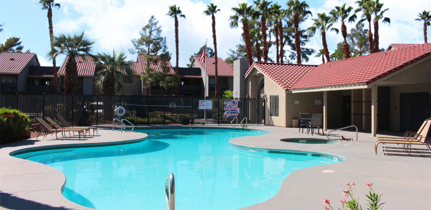 This image displays another swimming pool photo of Silver Palms Apartments